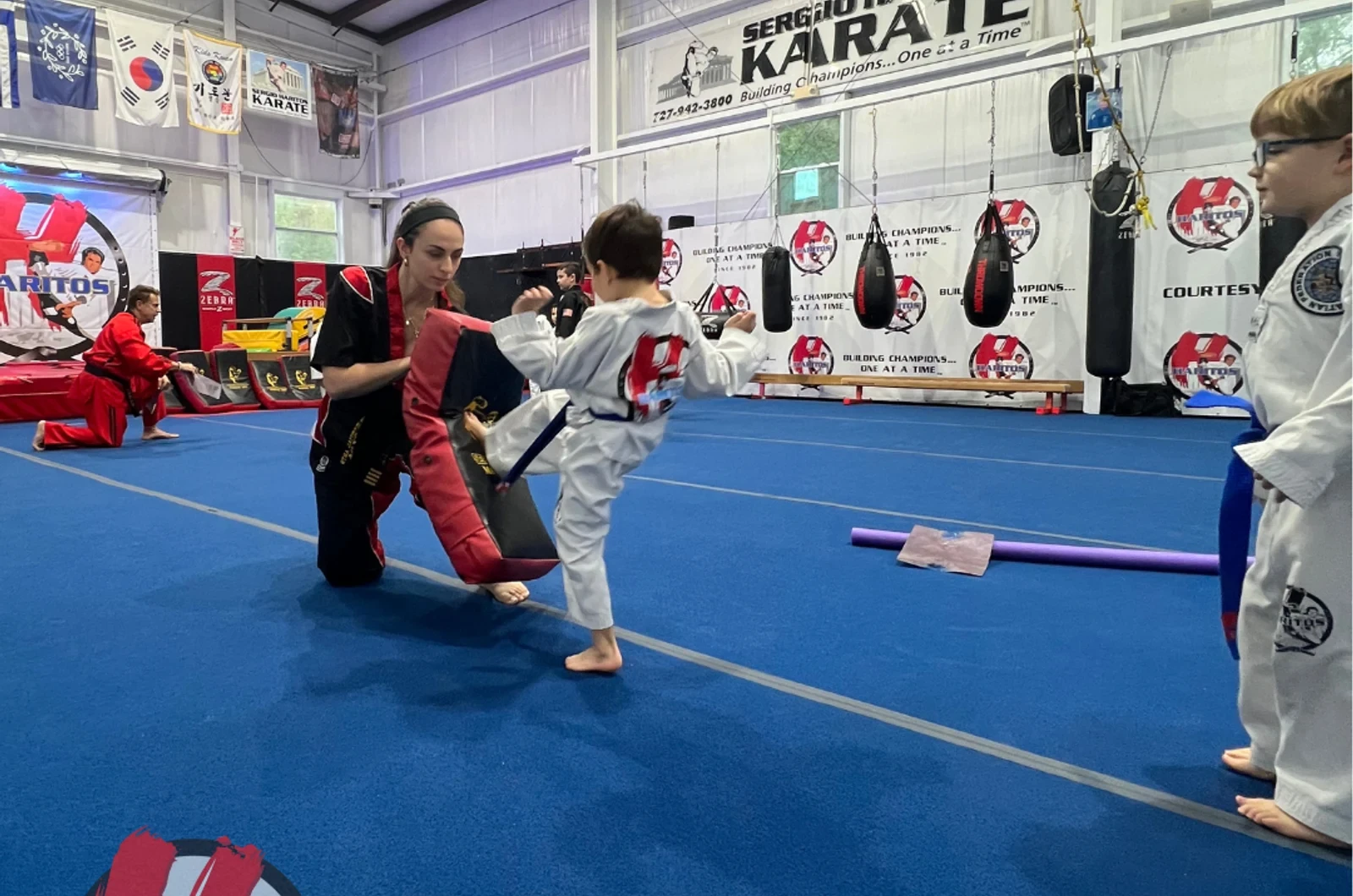 Kids learning sportsmanship through martial arts